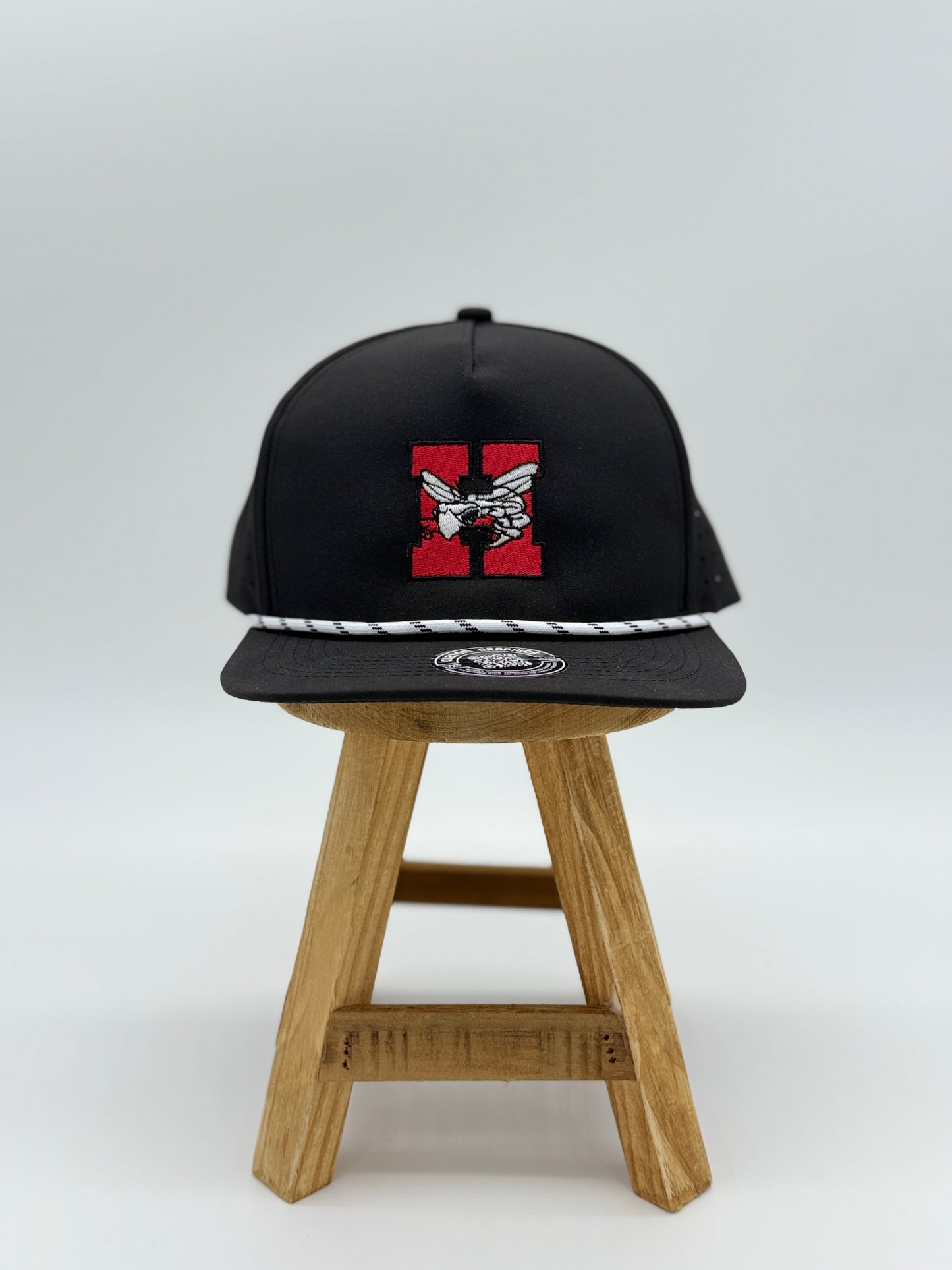 Hilldale H snapback hat by Cuztom Graphics in black with red H logo and white rope detail on brim